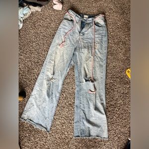 Size small light wash, straight leg, jeans with distressing and a braided belt